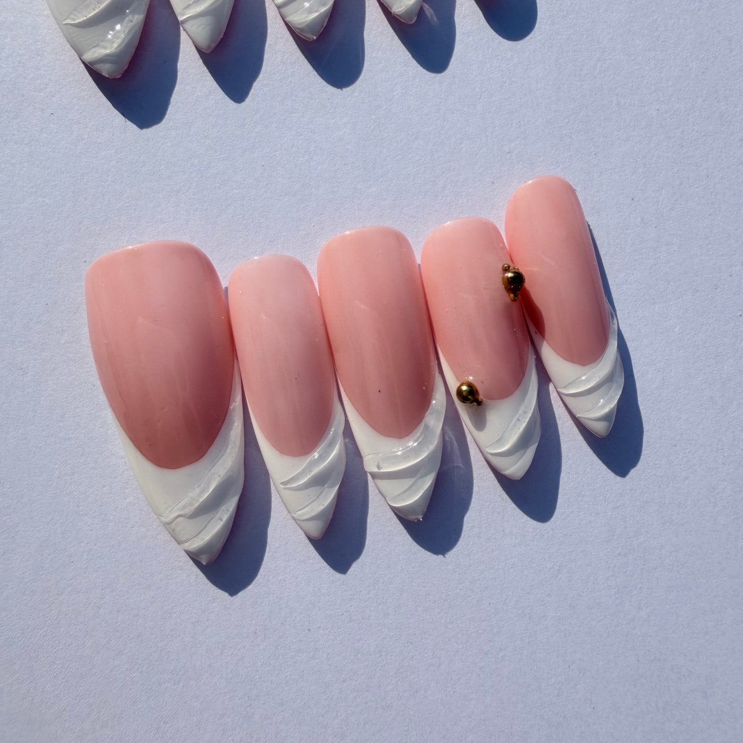 Pink Sculpted French Tip Press-On Nails – 3D White Swirl Tips with Gold Accents